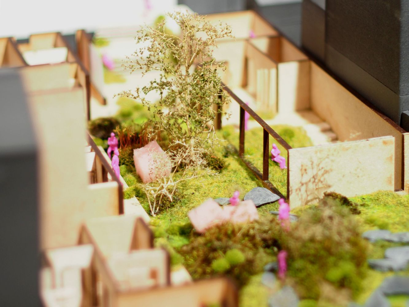 close up of wooden architectural model with miniature trees