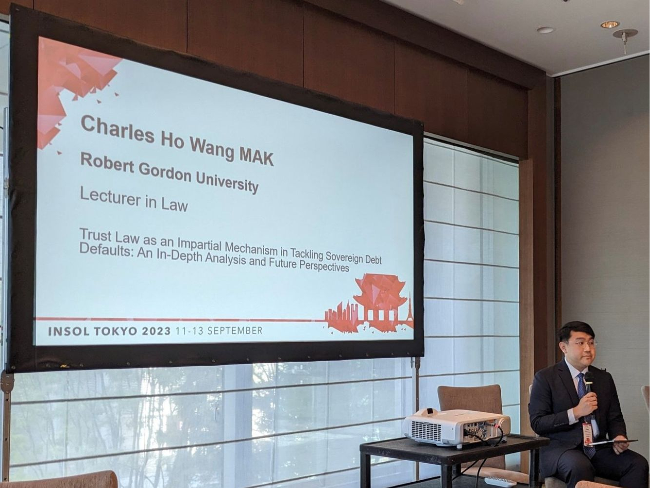 Charles Mak presenting his paper