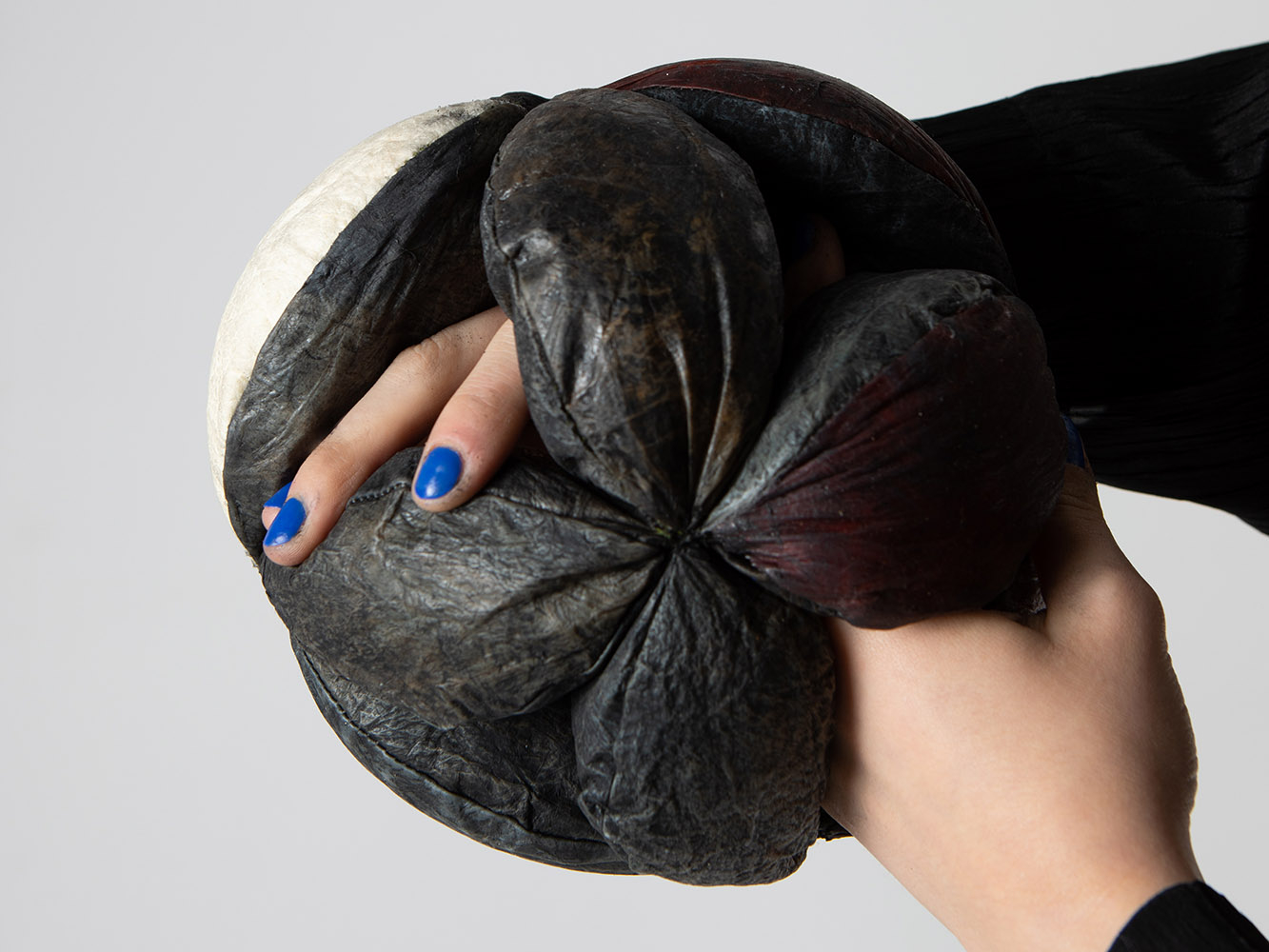Weronika's artwork depicting hands holding bio leather