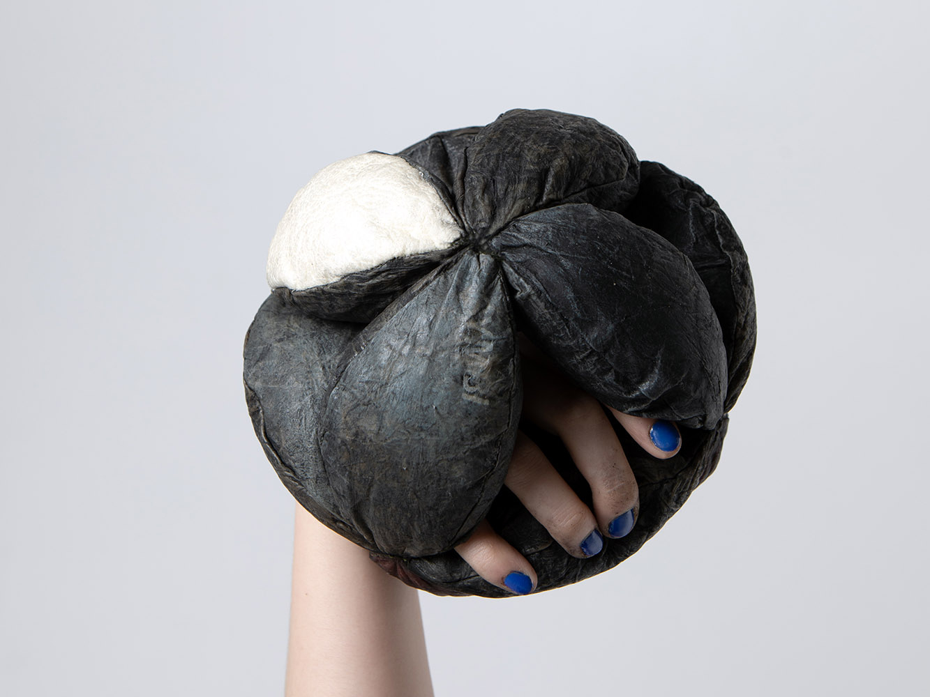 Weronika's artwork depicting hand holding bio leather