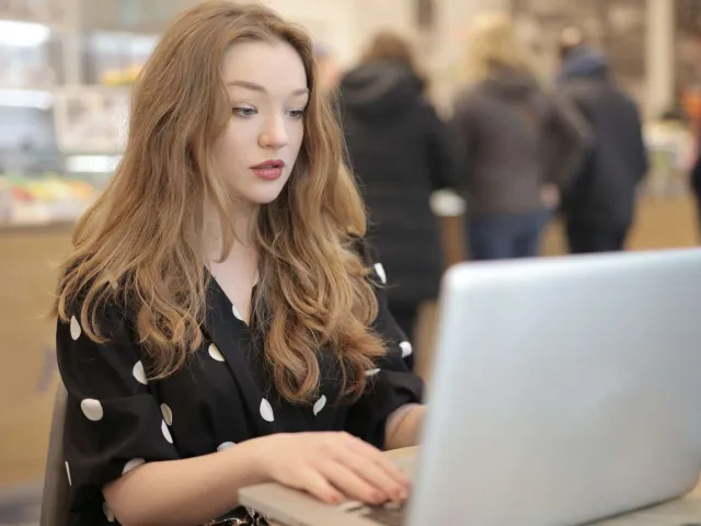 woman typing on laptop