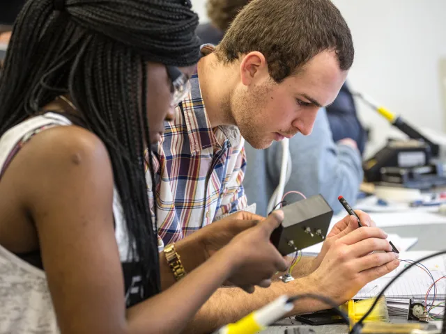 students working on electrical wiring