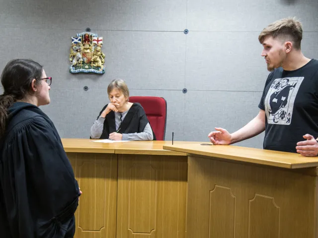 students debating in moot court