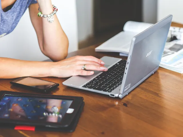 person using their laptop