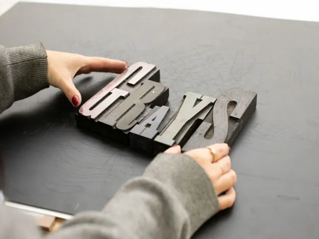 letterpress letters spelling out the word Grays