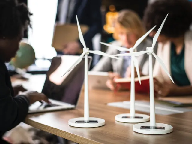 models of wind turbines on a desk