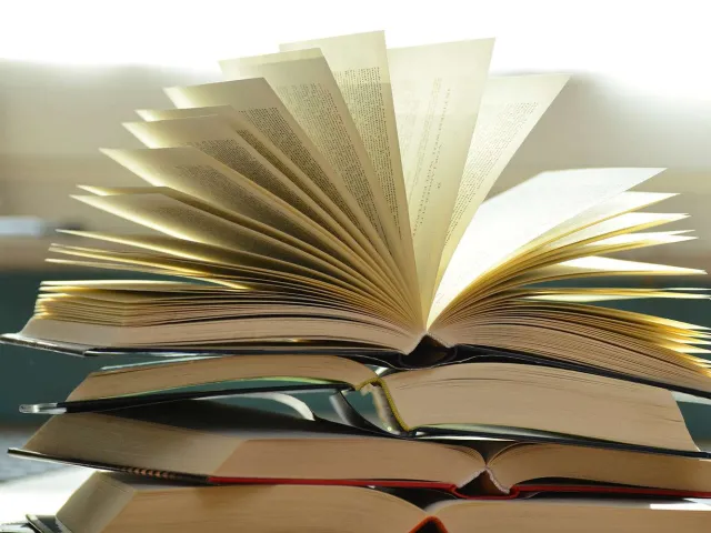 book sitting open with pages splayed