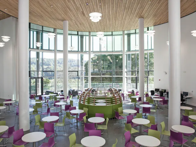 sir ian wood building atrium full of chairs