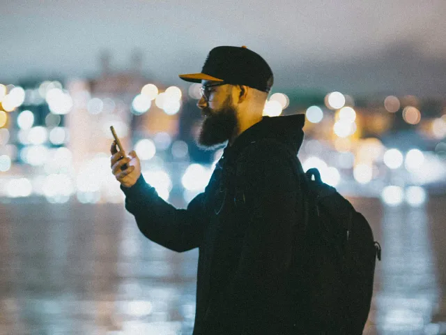 Person holding a mobile phone