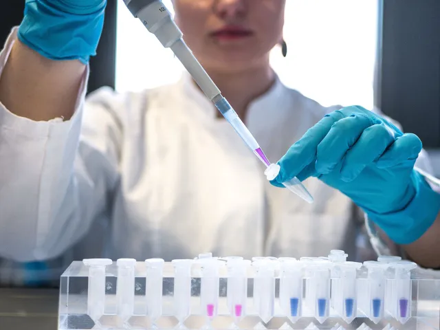 person using lab equipment