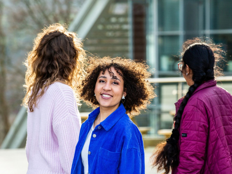 Three RGU students with one smiling at the camera