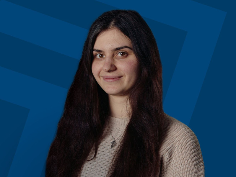 Jackie Velcheva from RGU in front of a blue background