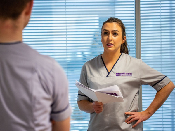 RGU student nurse reads from documents