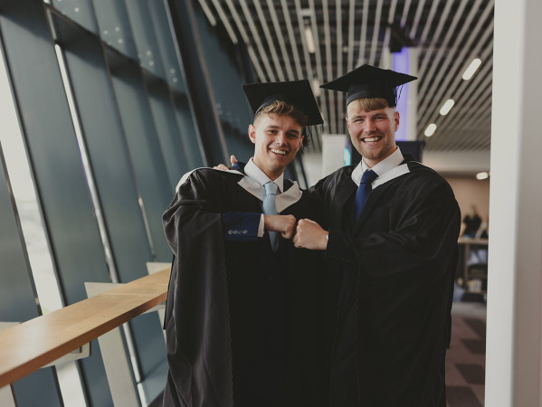 Students in graduation gowns