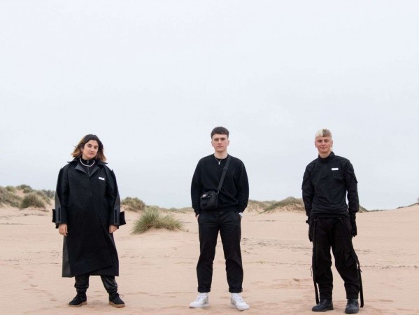 Models on Balmedie beach wearing Textile Design Student, Cameron Lyall's outer clothing collection, 'No Place'.