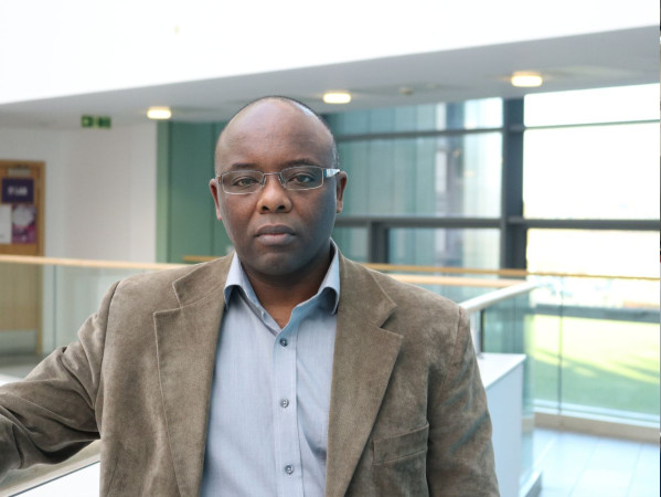 Professor James Njuguna standing next to a window at the RGU campus