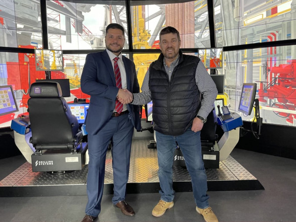 Paulo Morirz, director of operations ICM Group and Professor Phil Hassard, RGU’s drilling simulator manager with DART in the background.