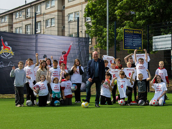 Willie Miller opens the new court with school children