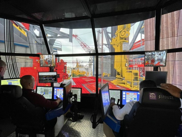 Two people use drilling simulator technology