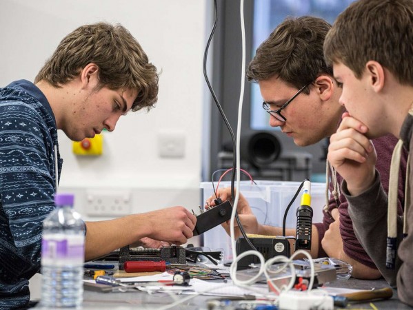 students in an engineering lab students in an engineering lab