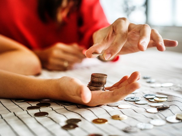 people holding money in their hands