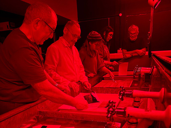 people in a darkroom