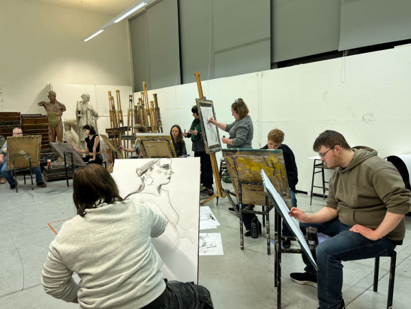 people drawing a portrait