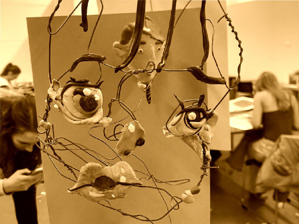 Sepia toned image of a wire sculpture of a face