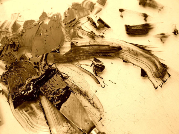 Sepia toned image of a smudge of ink or paint