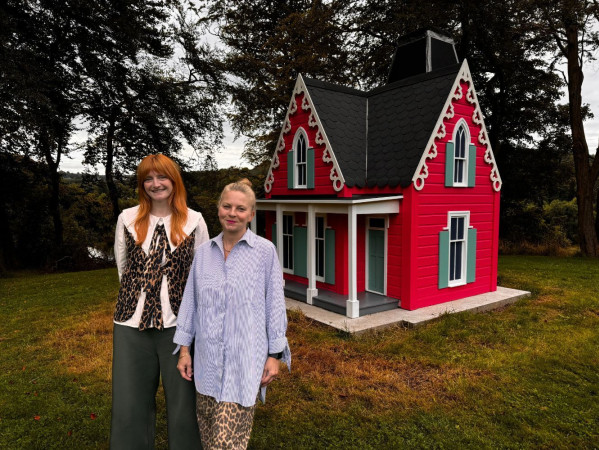 Image shows Sally and Claire Bruce from Look Again with 'A House in the Woods' sculpture Image shows Sally and Claire Bruce from Look Again with 'A House in the Woods' sculpture