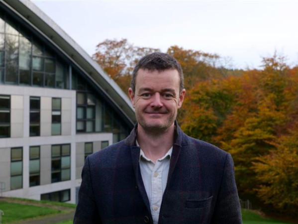 James Cunningham posing outside Robert Gordon University's Riverside Building