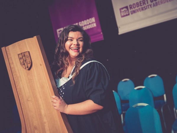 Kirstin steps out from behind-the-scenes of organising graduation ceremonies to collect her own master's degree Kirstin steps out from behind-the-scenes of organising graduation ceremonies to collect her own master's degree