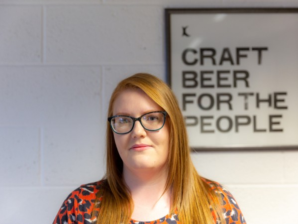 Louise Wyllie, Graduate Apprentice at BrewDog standing in office