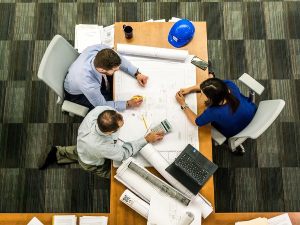 aerial view of a table with people in a meeting