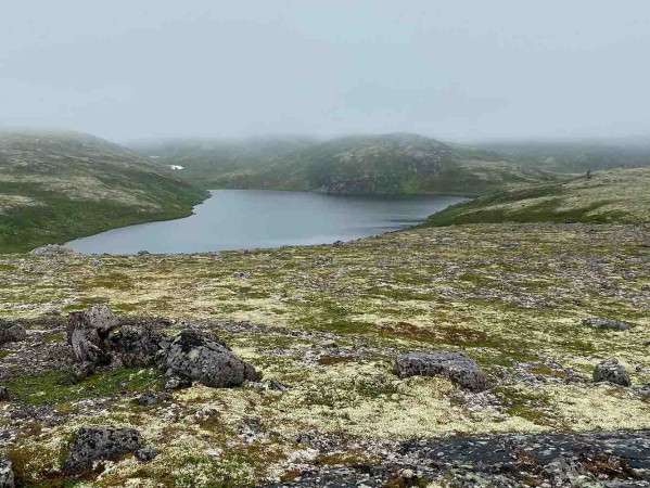 Lake in midst of green hills