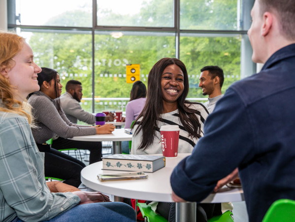 students smiling in the canteen area