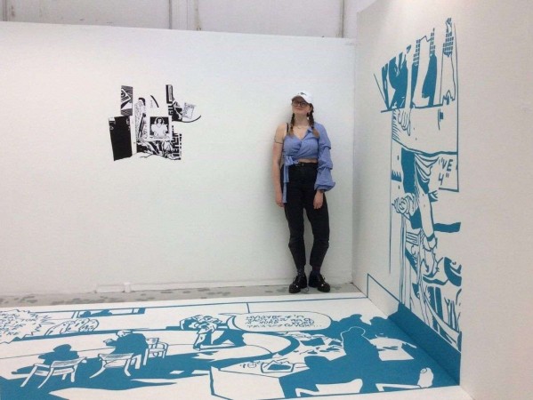 Image of Scarlett Keiller with artwork from her project 'Lost in Translation'