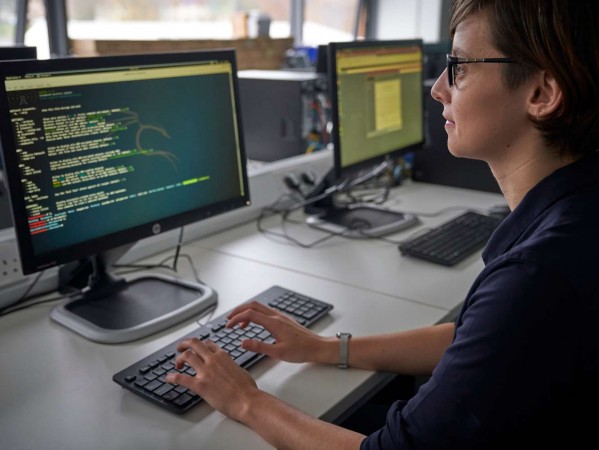 Person working at a computer Person working at a computer