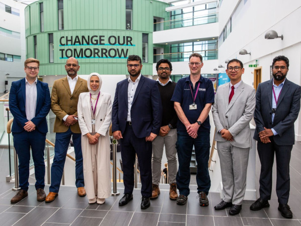 Delegates from RGU and Cygnas Solutions posing on campus