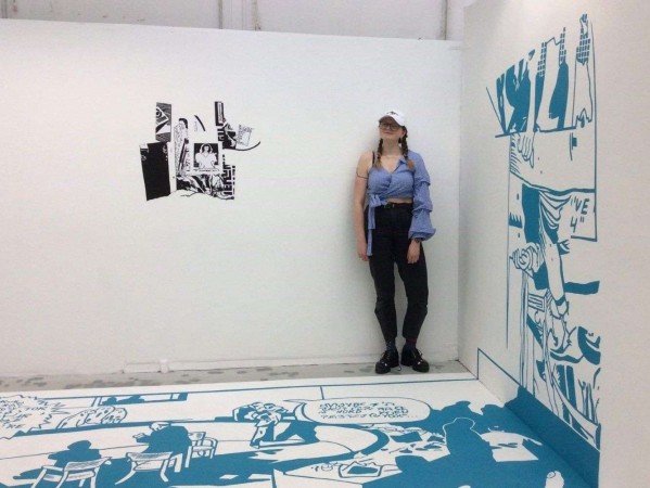 Image of Scarlett Keiller with artwork from her project 'Lost in Translation'