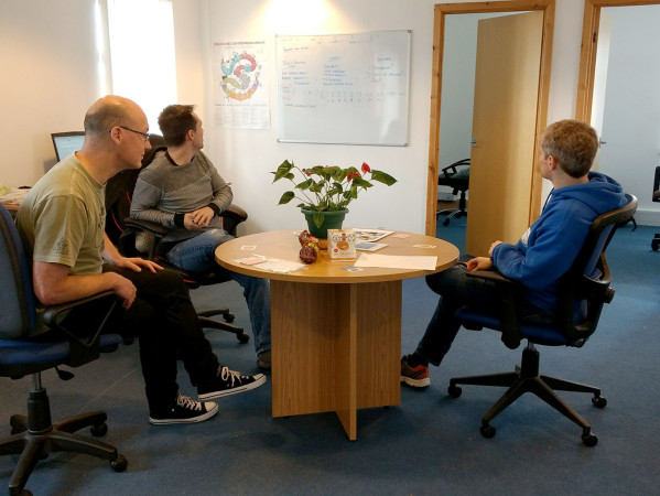 People in a meeting around a table