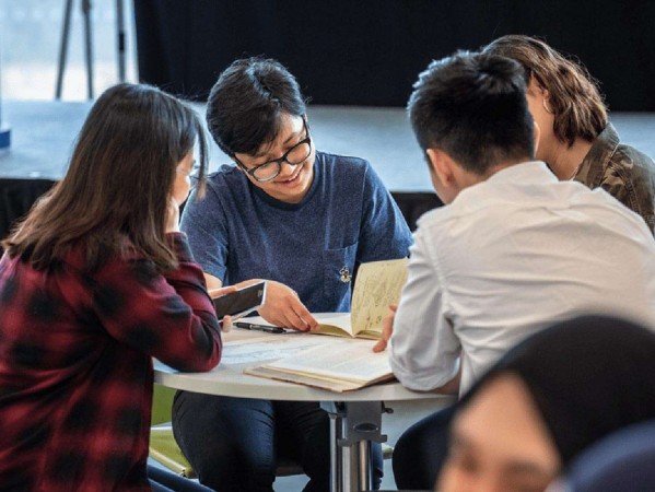 Students talking at a table