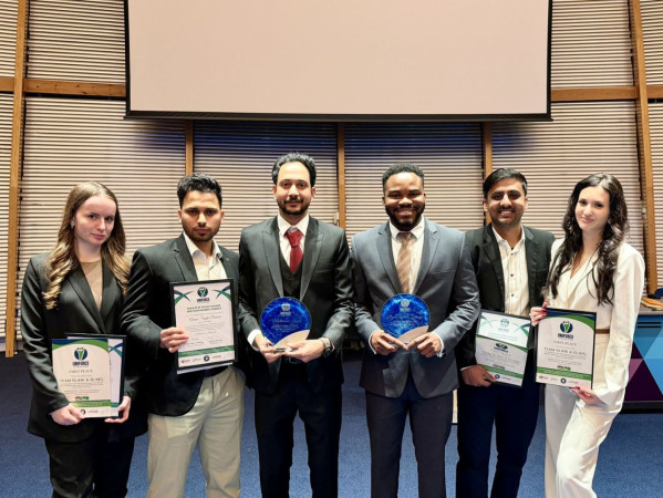 The winning team with our two Student Presidents holding the awards and certificates