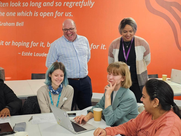 Bob Keiller from Our Union Street and Aisha Kasim, Startup Manager at RGU's Entrepreneurship and Innovation Group, speaking to students about their ideas for transforming Union Street in Aberdeen.