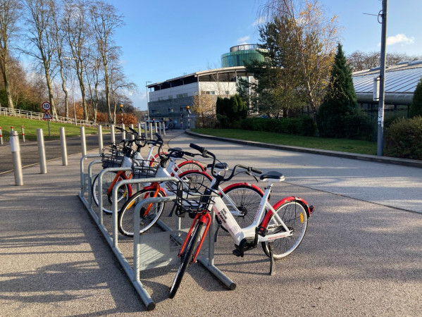 The red and white eBikes on RGU's campus.