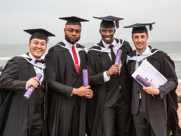 students in graduation gowns