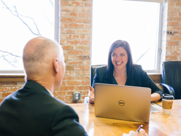 Two people talking in a meeting