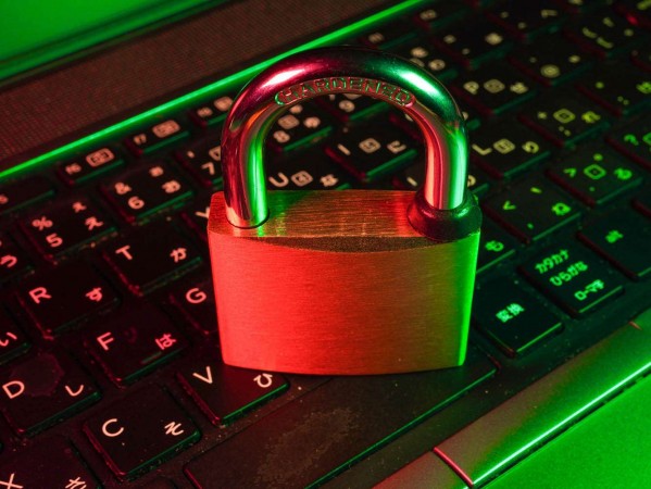 padlock on a keyboard padlock on a keyboard