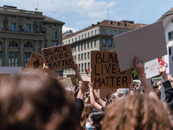 protest with people holding up signs