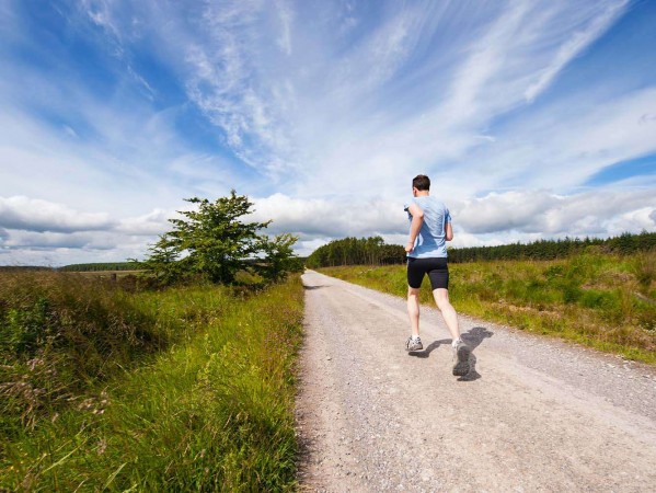 Man running on a country path